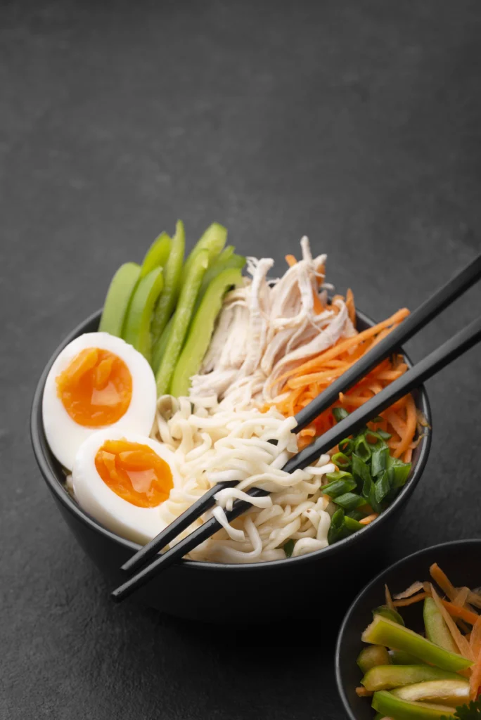 Healthy Korean bibimbap bowl with lean beef, vegetables, and egg.