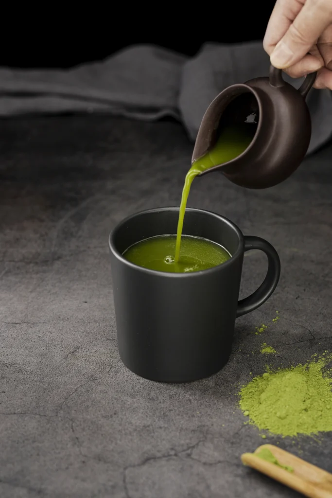 Matcha green tea cup surrounded by icons showing health benefits
