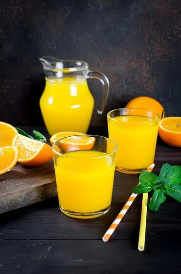 Orange agua fresca with mint and citrus slices