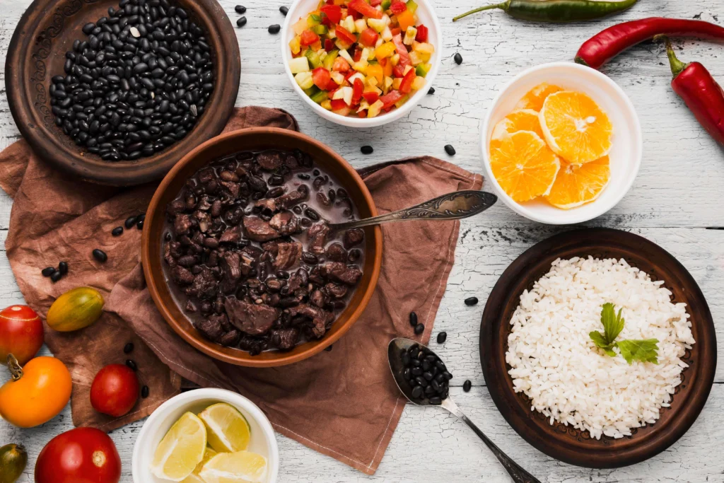 Feijoada served at a Brazilian family gathering with drinks and music.
