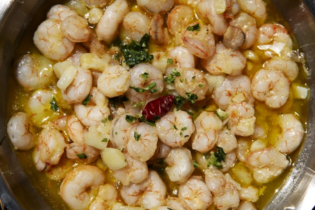 Spanish shrimp in garlic sauce with artisan bread.