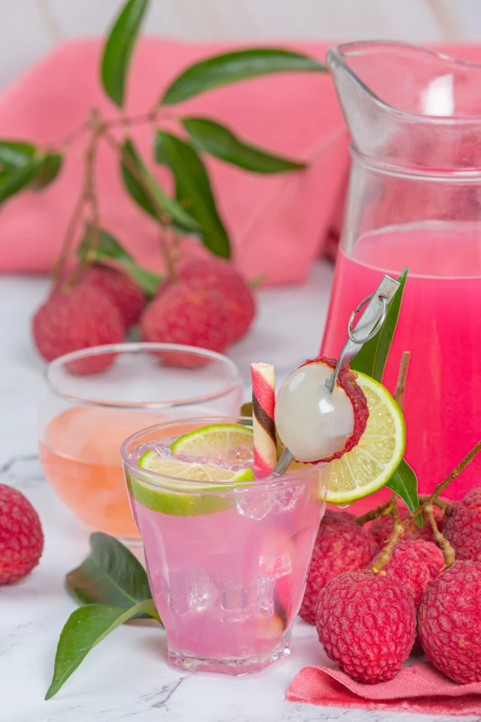 Top view of Strawberry Lime Vodka Smash surrounded by sliced strawberries and lime.