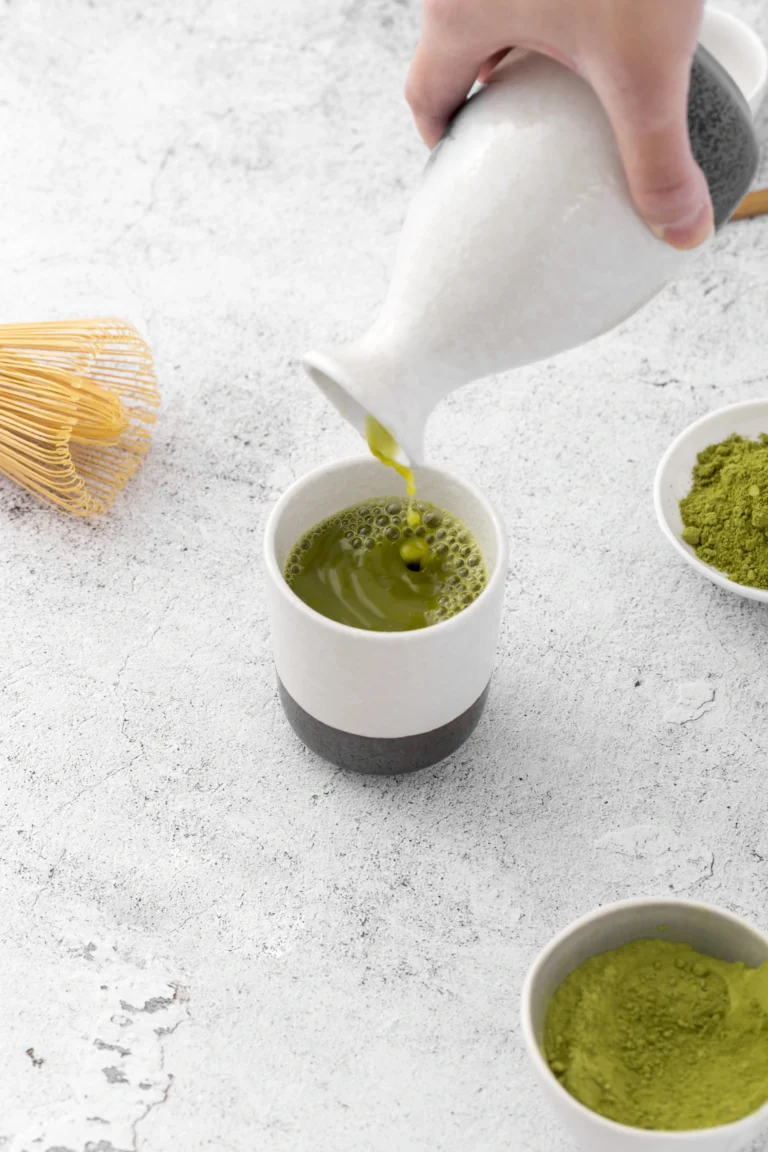 Organic matcha green tea powder in a ceramic bowl
