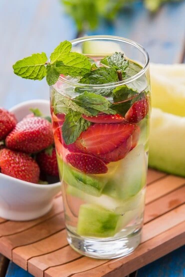 Glass of chilled watermelon agua fresca with mint