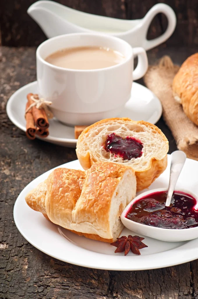 Italian-style breakfast featuring Cappuccino e Cornetto and milk
