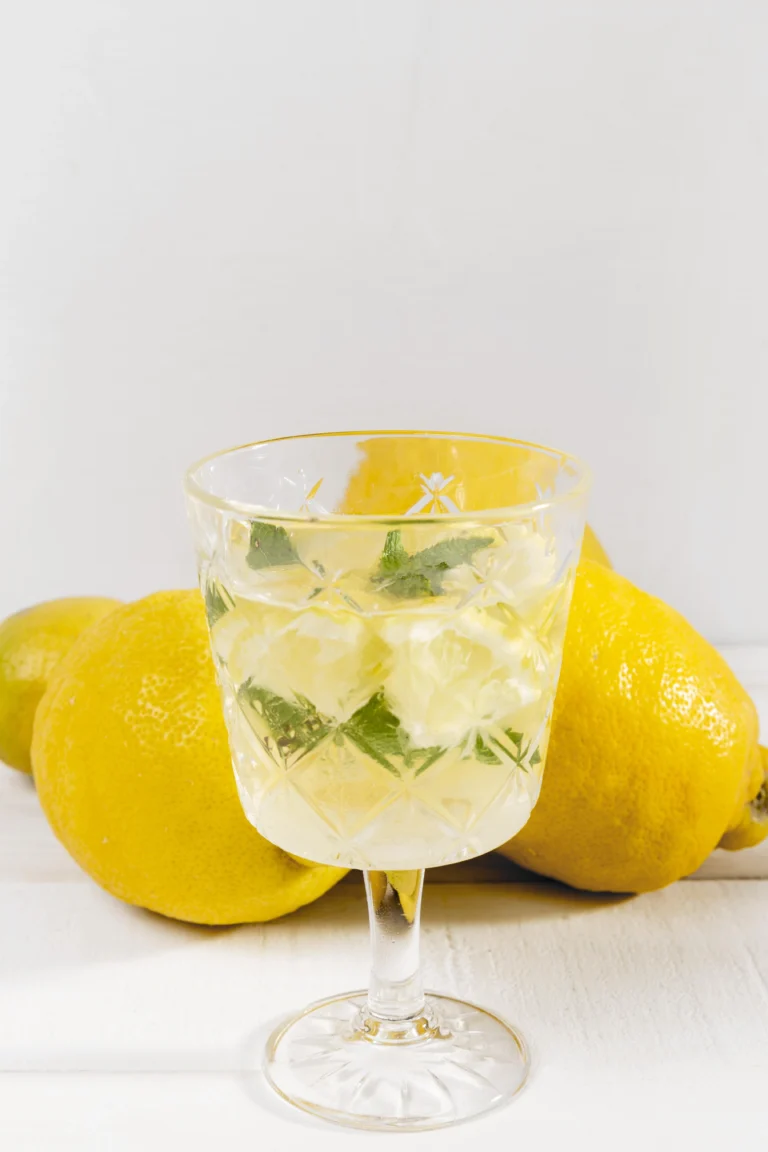 A refreshing Limoncello Spritz cocktail served in a wine glass with ice, lemon slice garnish, and sparkling bubbles.