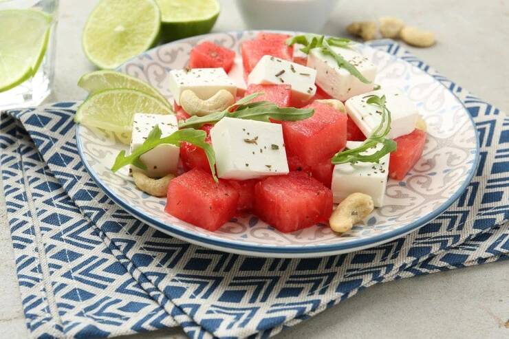 Aesthetic food plate with watermelon, grilled feta, mint, and balsamic drizzle.