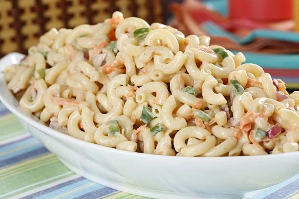 Traditional macaroni salad with creamy sauce and colorful vegetables