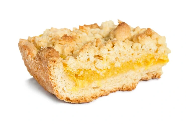 Close-up of stacked lemon crumb bars with a buttery crust and creamy lemon filling.