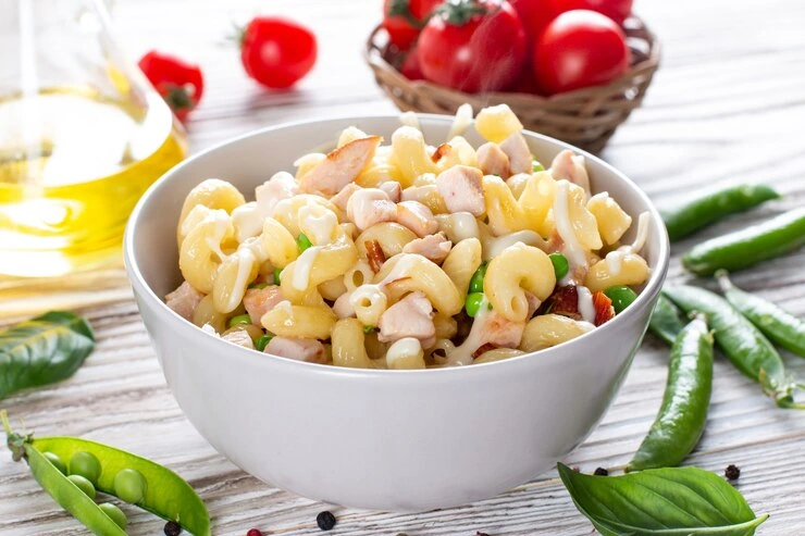 Cold macaroni salad with creamy dressing and fresh green onions